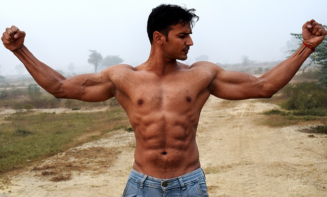 Muscular man showing armpits