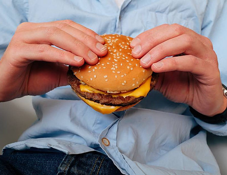 Man eating junk food